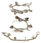 Three silver charm bracelets with over twenty silver charms including horseshoe, fish, cannon, etc ,