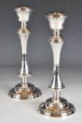 Pair of Elizabeth II hallmarked silver candlesticks, Birmingham 1989, maker W I Broadway & Co,