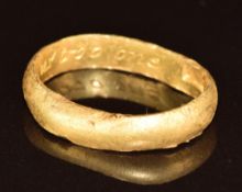 Antique yellow metal posy ring engraved to the inner band 'God alone made us troo one', stamped with