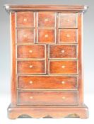 Mahogany apprentice / collector's chest of six square and four further drawers over two straight