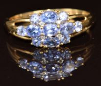 A 9ct gold ring set with tanzanites and diamonds, 2.6g, size T