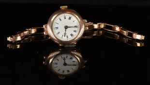 Unnamed 9ct gold ladies wristwatch with blued Breguet hands, black Roman numerals, white dial and