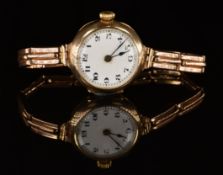 Unnamed 9ct gold ladies wristwatch with blued hands, black Arabic numerals, white dial and
