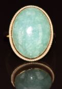 A 9ct gold ring set with a quartz cabochon, 5g, size P