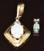 A 14k gold pendant set with an opal cabochon and diamonds and a 14k white gold pendant set with an