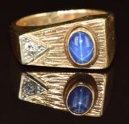 A 9ct gold ring set with a star sapphire and diamond, 10g, size T