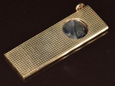 A 9ct gold cigar cutter with engine turned decoration, 24g