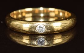 An 18ct gold ring set with a diamond of approximately 0.05ct, 3.4g, size M