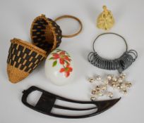 Collectibles comprising celluloid figurine, horn net making or mending needle, straw work egg shaped