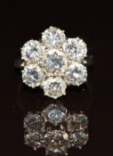 An 18ct white gold ring set with a cluster of diamonds, the total diamond weight approximately 4.
