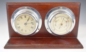 H Hughes and Son bulkhead clock and barometer mounted on a mahogany stand, together with a Sestrel