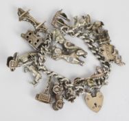 A silver charm bracelet with fifteen silver charms including, cat, squirrel, etc, 79g