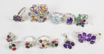 Two suites of silver jewellery comprising ring, pendant and earrings, one set with amethysts and the