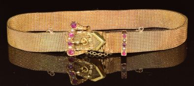 Edwardian 9ct gold bracelet in the form of a buckle set with rubies and split pearls, 15.7g, 17.5cm