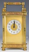 Brass cased carriage clock with bevelled glass and silvered and gilt dial, height including handle