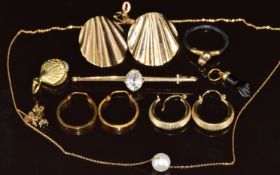 Four pairs of 9ct gold earrings, a 9ct gold shell pendant, elephant hair ring, black coral charm,