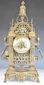 19th century pierced cast brass mantel clock with enamel Roman numerals and two train movement