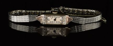 Art Deco 18ct gold ladies wristwatch set with blued hands, Arabic numerals, silver dial, diamond set