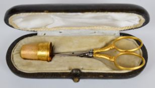 French 19thC gold scissor and thimble set with engraved and repoussé decoration in fitted leather