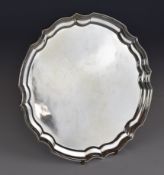 Elizabeth II hallmarked silver salver with shaped edge, raised on three feet, Birmingham 1972, maker