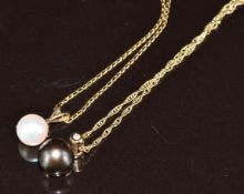 Two 9ct gold pendants, each set with a pearl and diamond and on 9ct gold chains, 3.2g
