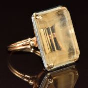 A yellow metal ring set with an emerald cut citrine, 9.4g, size M