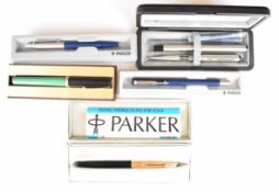 A collection of fountain and ballpoint pens including cased Parker pens