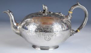Victorian silver teapot, of globe shape with engraved decoration and naturalistic knob or finial,