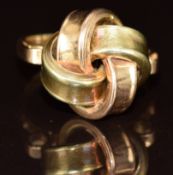 A 9ct gold bi-coloured ring in the form of a knot, 5.9g, size M
