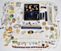 A collection of jewellery including silver bracelet, vintage and silver earrings, brooches including
