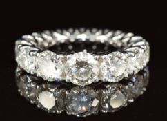An 18ct gold ring by John Rasmussen set with eighteen round cut diamonds totalling approximately 5.
