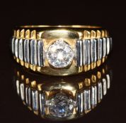 An 18ct gold ring set with cubic zirconia, 10.6g, size U