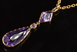 Edwardian 9ct gold pendant set with an oval, pear and kite cut amethyst (4cm) on 9ct gold chain, 5.