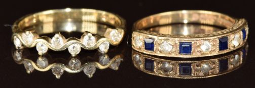 Two 9ct gold ring, one set with diamonds in a wavy setting and the other set with sapphires and