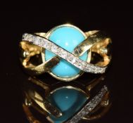 A 14k gold ring set with a turquoise cabochon and cubic zirconia, size P