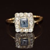 An 18ct gold ring set with a sapphire and diamonds, 2.2g, size O