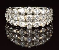 An 18ct white gold ring set with three rows of graduated diamonds, 4.5g, size H
