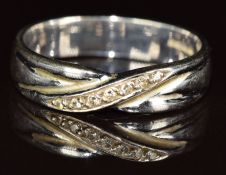 An 18ct white gold ring set with diamonds in a cross over setting, 3.5g, size N