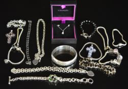 A collection of silver jewellery including ten bracelets, two cross pendants, two chains, bangle,