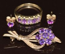 A 9ct gold ring set with five oval cut amethysts (size K), 9ct gold brooch set with amethysts and
