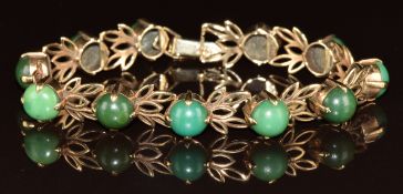 A 9ct gold bracelet set with eleven round cut turquoise cabochons, 15g, 17cm