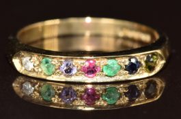 A 9ct gold ring set with a diamond, emerald, amethyst, ruby, emerald, sapphire and tourmaline