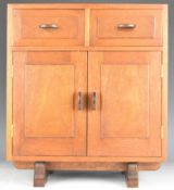 Austin Gardiner Arts & Crafts apprentice chest of two drawers above cupboards, with stamps to tops