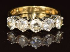 An 18ct gold ring set with five diamonds of approximately 0.39ct, 0.34ct, 0.34ct, 0.3ct and 0.3ct,