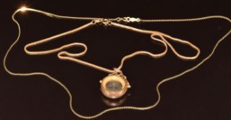 A 9ct gold compass pendant (Birmingham 1906) on 9ct gold chain (2g, 36cm) and a 14k gold chain (1.
