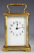 Brass cased carriage clock with bevelled glass and white enamel dial marked France, height including