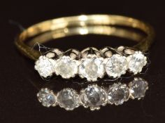 An 18ct gold ring set with five diamonds, 2.4g, size Q