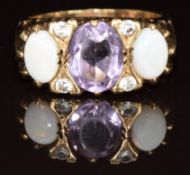 A 9ct gold ring set with an amethyst and opals, 5.4g, size O
