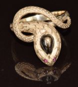 A 14k gold ring in the form of a snake with a synthetic star sapphire and spinel eyes, 4.2g, size N