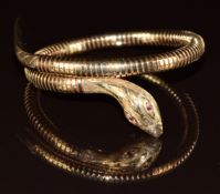 A 9ct gold bangle in the form of a serpent set with ruby eyes, Birmingham 1995, 25.6g